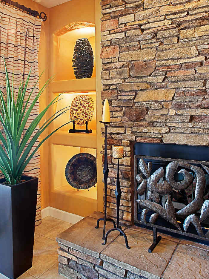 πέτρινο τζάκι με καλλιτεχνική χροια